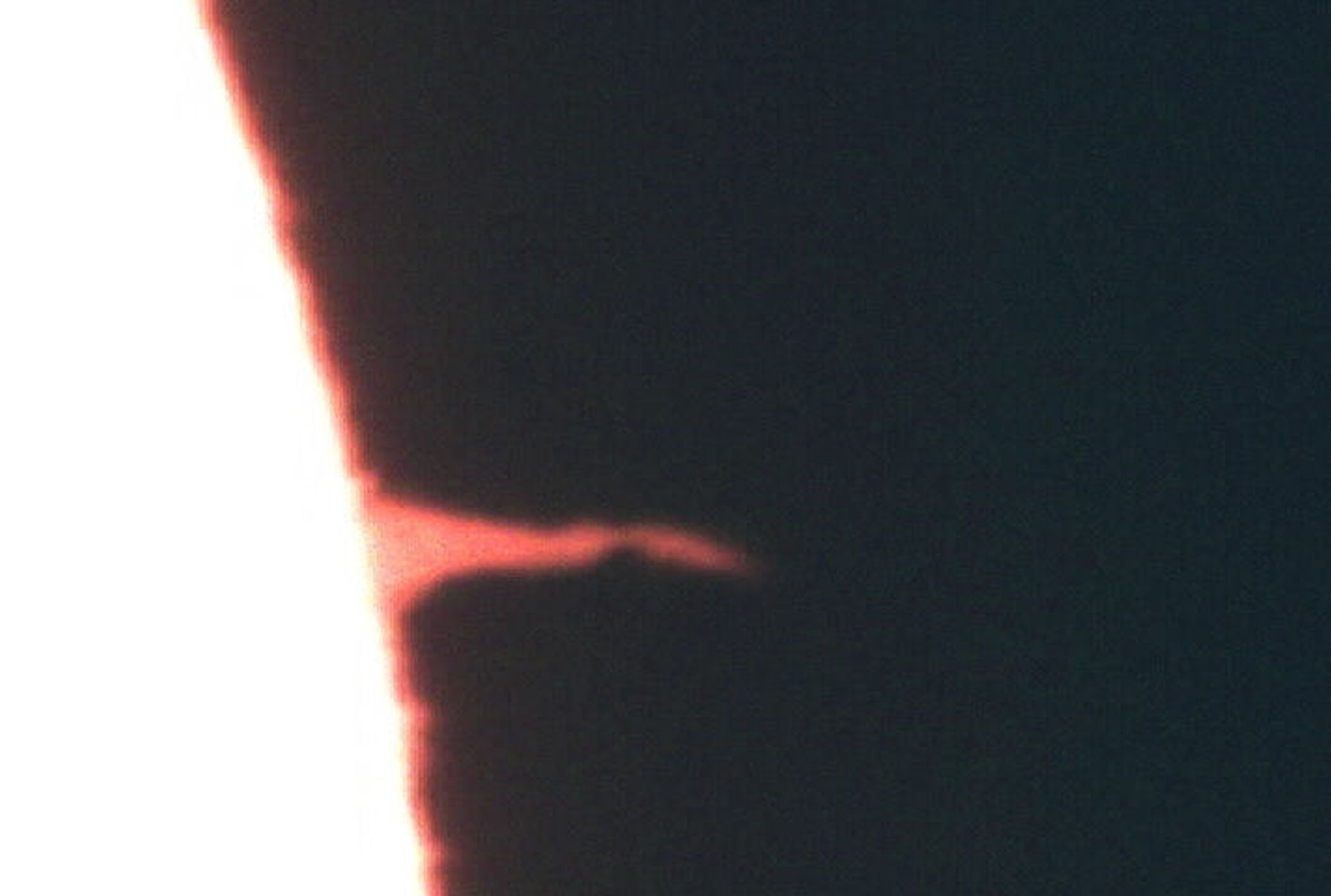 "Solar spike" by T Hayes. I believe this is the same "spike" as the one shown in monochrome on 17th August, but this picture from a video taken on Sunday 16th Aug. at 18.35 local time.